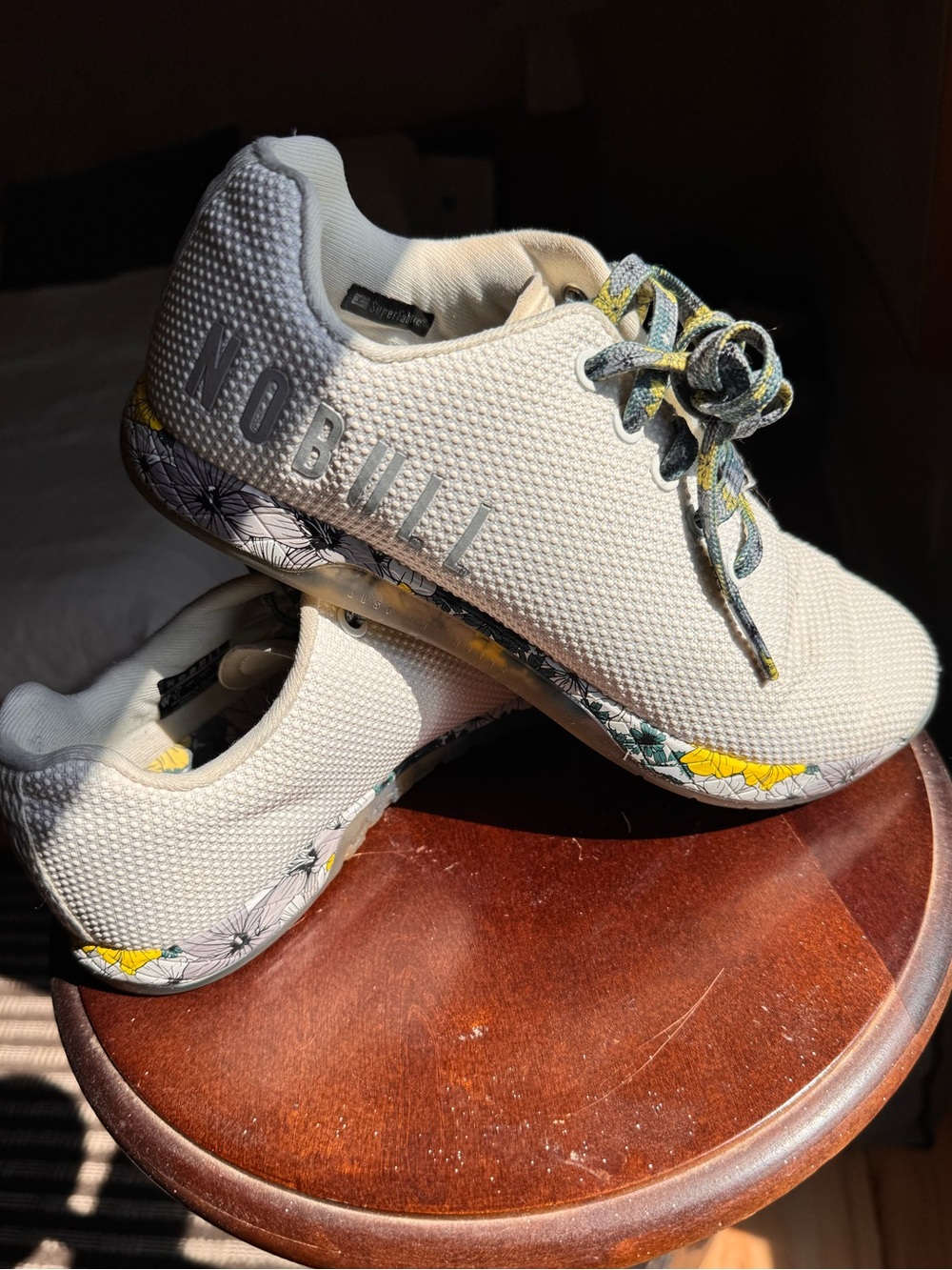 NOBULL womenโs Cream Sneakers with Floral Details